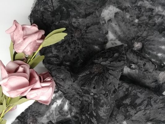 Il partito svuotato del ricamo merletta il tessuto nero di applique dello zecchino 3D